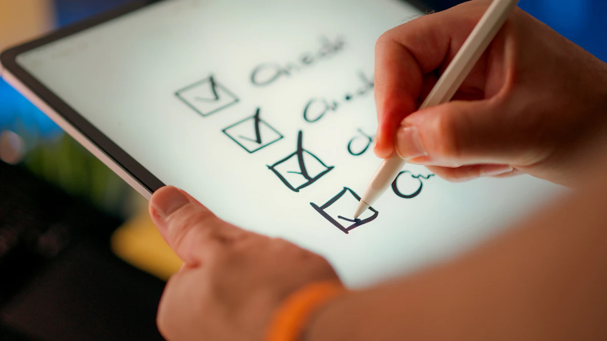 Hand ticking items on a checklist on a tablet