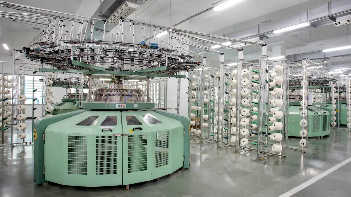 Rows of circular knitting machines on a knitting factory floor